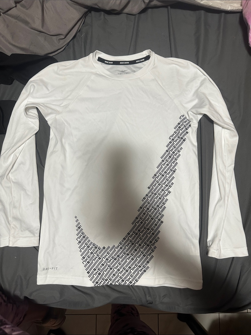 Nike White Long Sleeve Dri-FIT Shirt with Black Graphic Swoosh